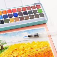 MeiLiang - Juego de pintura acuarela, 36 colores vivos en caja de bolsillo con anillo de metal y pincel de acuarela, perfecto para estudiantes, niños, principiantes y más - Arteztik
